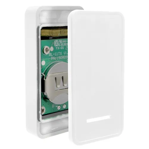 Biały, prostokątny dzwonek bezprzewodowy z widocznym wnętrzem elektronicznym i miejscem na baterię. Obudowa jest minimalistyczna z gładką powierzchnią i wąskim otworem na dole.