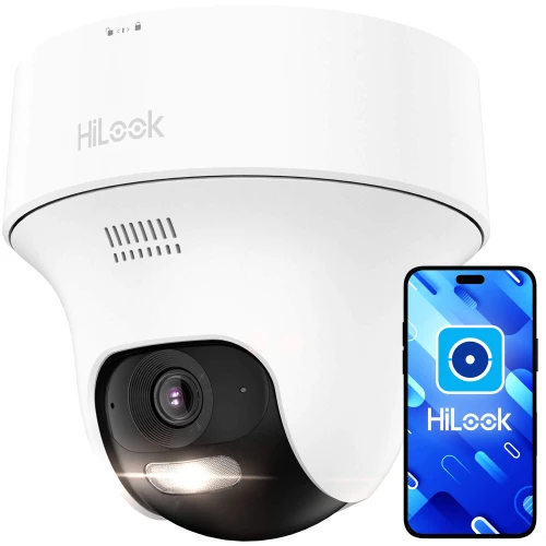 Biała kamera monitoringu HiLook z widocznym obiektywem i czujnikiem ruchu jest przedstawiona obok smartfona z aplikacją HiLook na ekranie. Tło jest jednolite, co podkreśla nowoczesny design urządzenia.