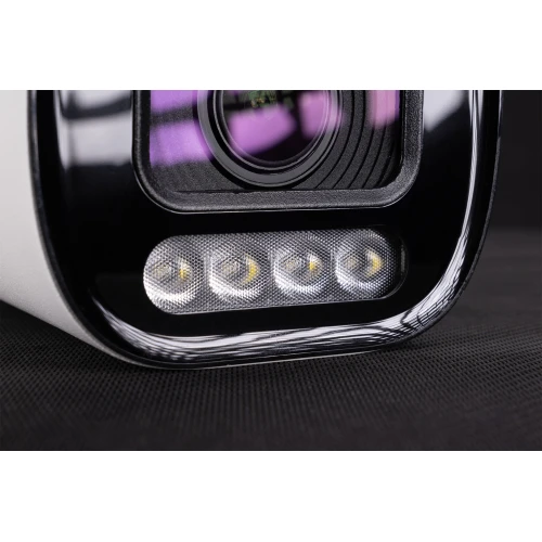 Zbliżenie na obiektyw kamery tubowej z widocznymi diodami LED poniżej. Kamera ma czarną obudowę z połyskiem i znajduje się na ciemnym tle.