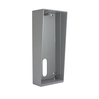 Metalowa obudowa natynkowa w kolorze szarym z otworem na przewody i miejscem na montaż urządzenia. Konstrukcja jest prosta i funkcjonalna, przeznaczona do instalacji na ścianie.
