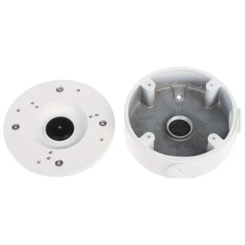 Zdjęcie przedstawia dwie części białej, okrągłej obudowy kamery monitoringu, z widocznymi otworami montażowymi i metalowym wnętrzem. Po lewej stronie znajduje się pokrywa z centralnym otworem, a po prawej główna część obudowy z miejscem na montaż kamery.