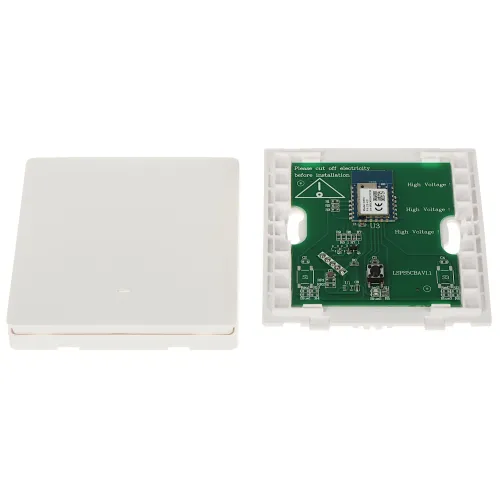 Zdjęcie przedstawia otwartą obudowę urządzenia elektronicznego z widoczną płytką drukowaną i komponentami wewnętrznymi. Obok znajduje się zamknięta pokrywa obudowy w kolorze białym.