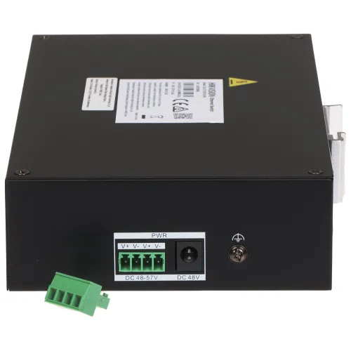 Czarny metalowy moduł z widocznymi złączami zasilania i etykietą informacyjną na górze. Na przednim panelu znajdują się zielone złącze śrubowe oraz gniazdo zasilania DC.